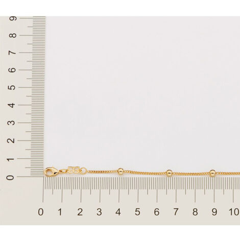 Foto com imagem de régua medindo a pulseira infantil bolinhas banhada a ouro 18k. Código 550104
